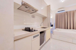 Comfy Designed and Modern Studio at Sky House BSD Apartment By Travelio